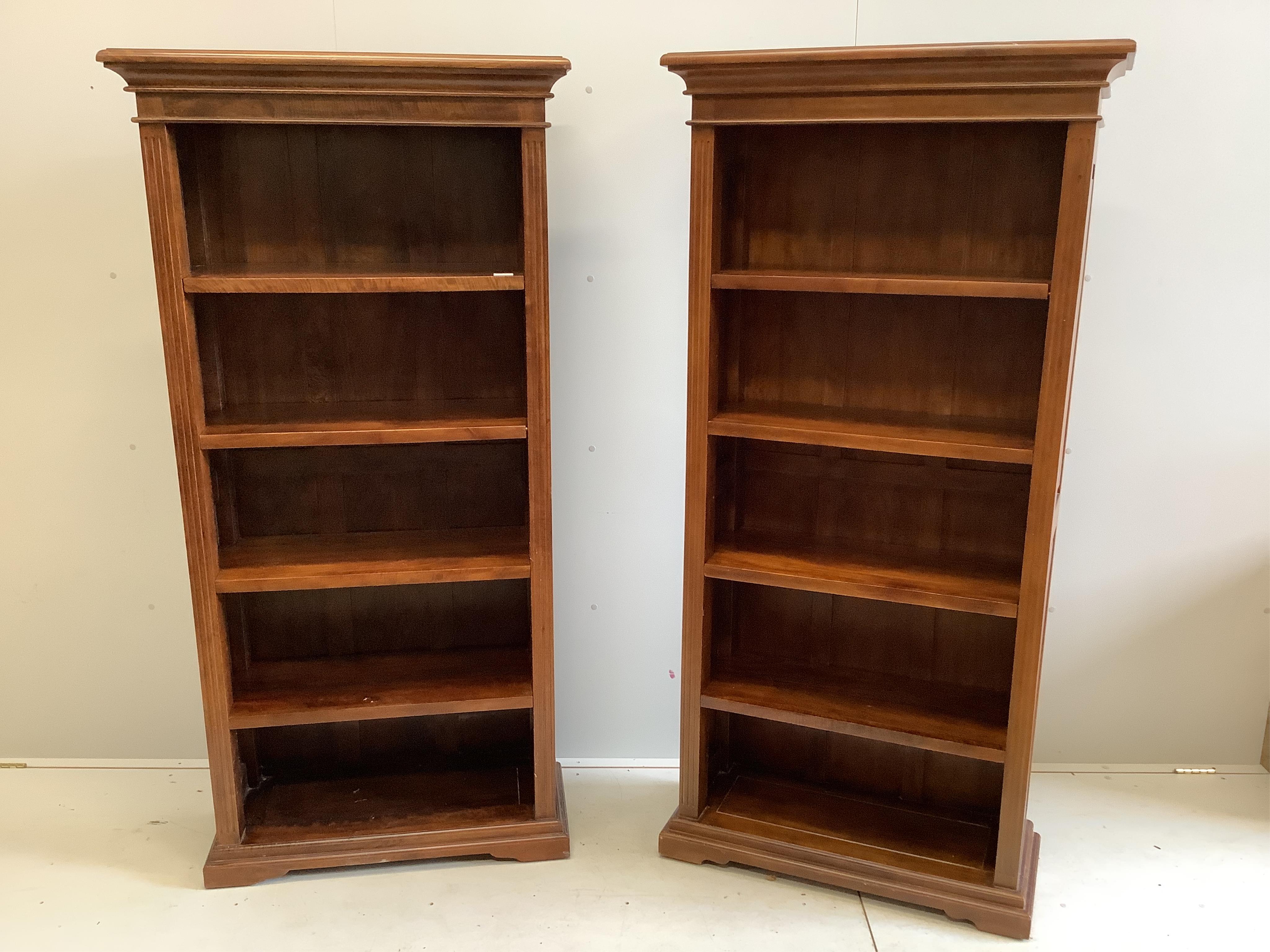 A pair of reproduction hardwood open bookcases, width 86cm, depth 36cm, height 179cm. Condition - good